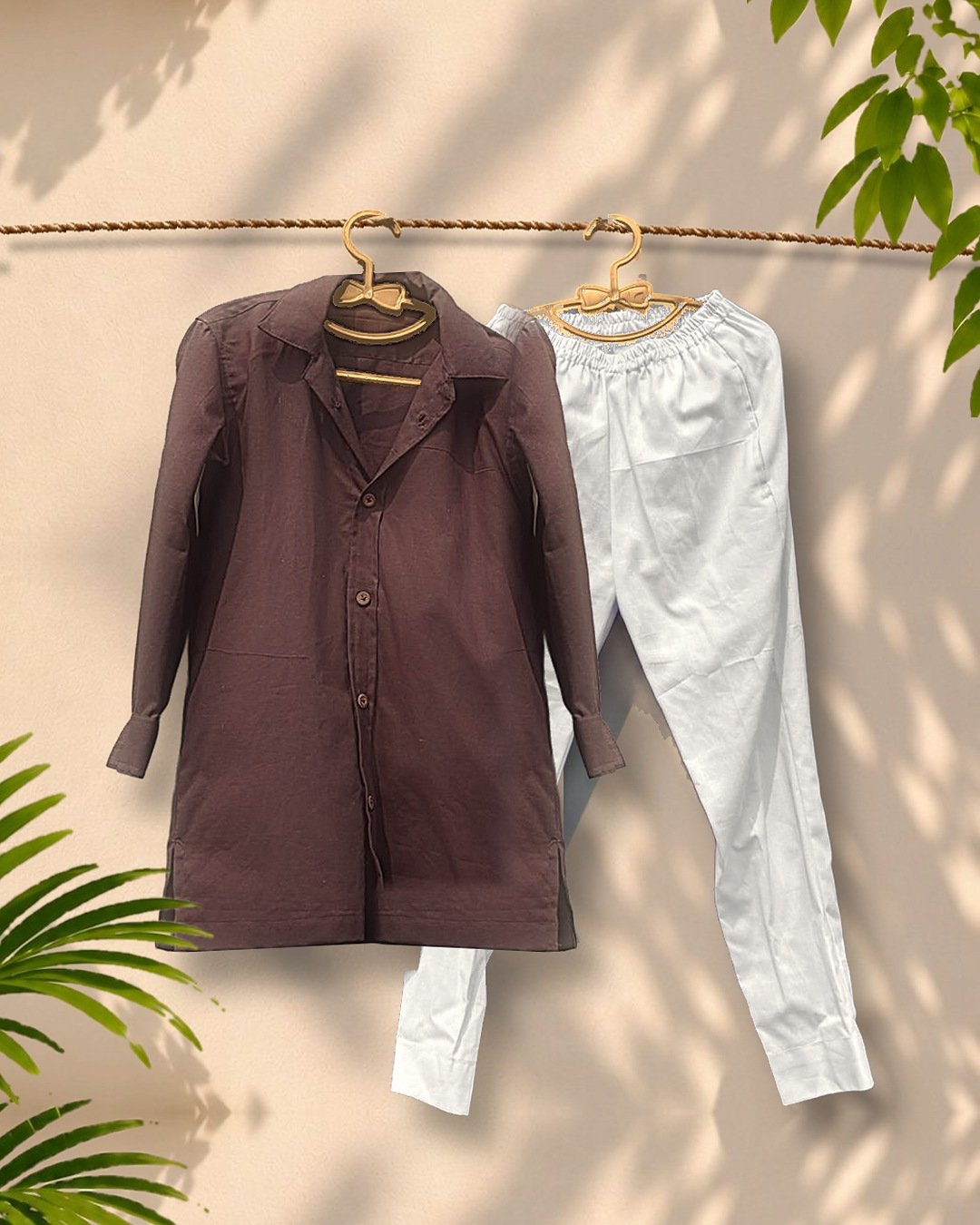 Chocolate-brown collared cotton kurta with white pajama on wooden hangers